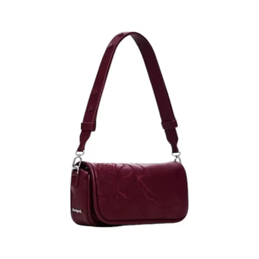 Burgundy leather shoulder bag with textured surface and silver hardware by Desigual