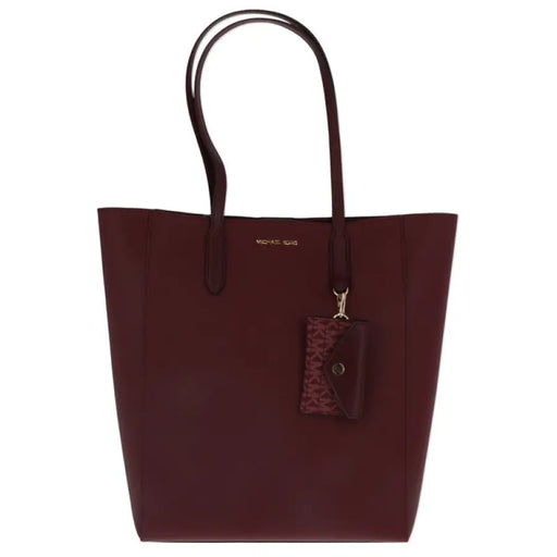 Burgundy leather tote bag by Michael Kors featuring double handles and a charm tag