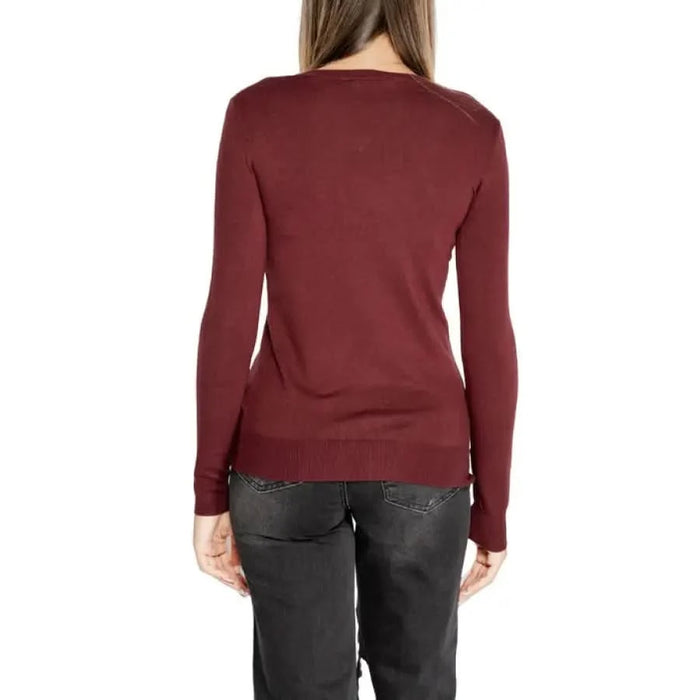 Burgundy long-sleeved sweater displayed from the back in Guess Women Knitwear collection