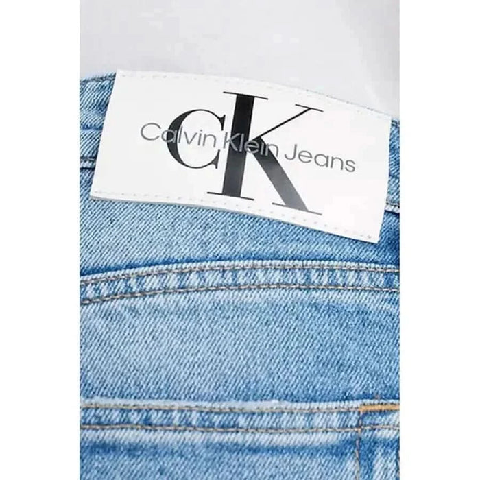 Calvin Klein Jeans label stitched onto premium denim fabric for men’s jeans