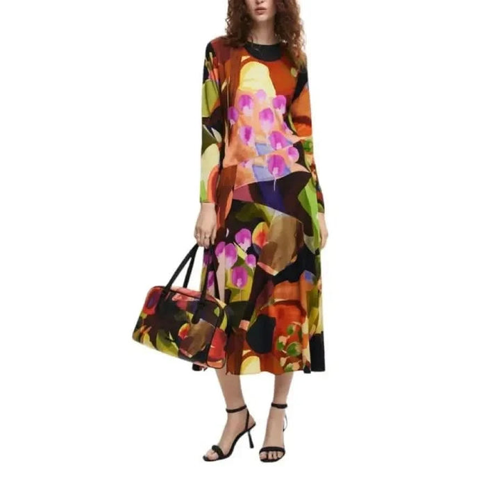 Colorful floral print midi dress with long sleeves and matching handbag by Desigual