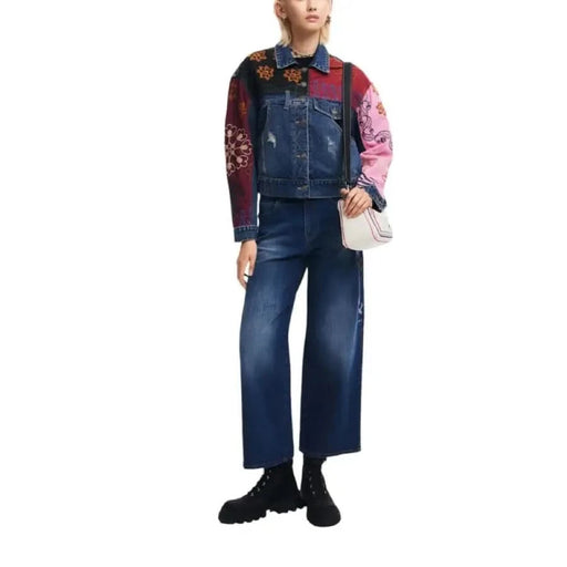 Colorful patchwork denim jacket with floral sleeves and wide-leg jeans by Desigual