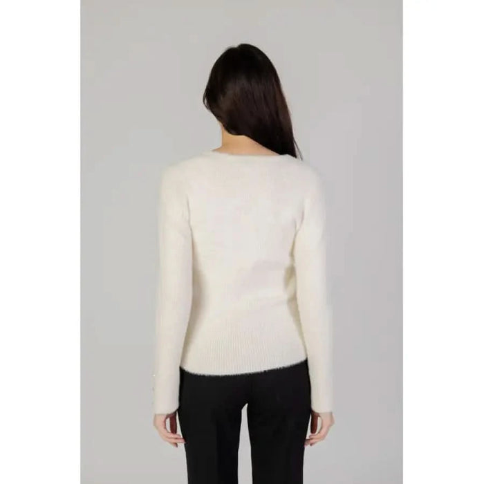 Cream-colored knit sweater worn by a person, featured in Morgan De Toi Women Knitwear