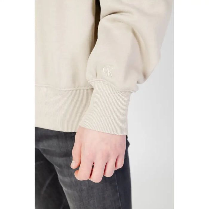 Cream-colored Calvin Klein Jeans sweatshirt sleeve with ribbed cuff and CK logo