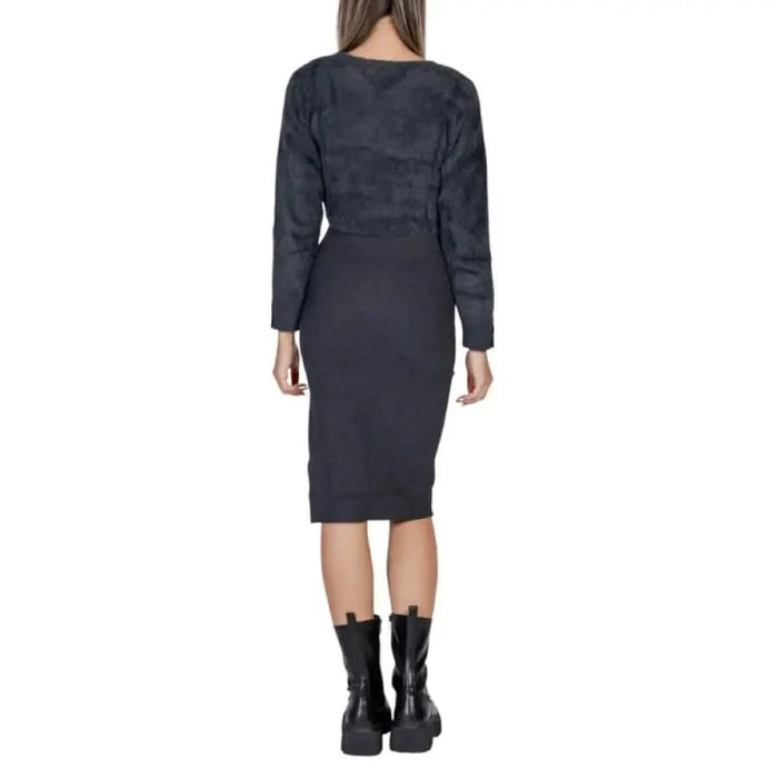 Dark gray long-sleeved bodycon dress by Morgan De Toi worn by woman from behind