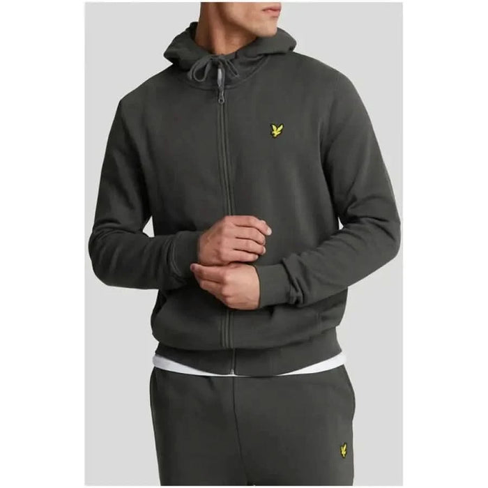 Dark gray zip-up hoodie for men featuring a small yellow logo on the chest