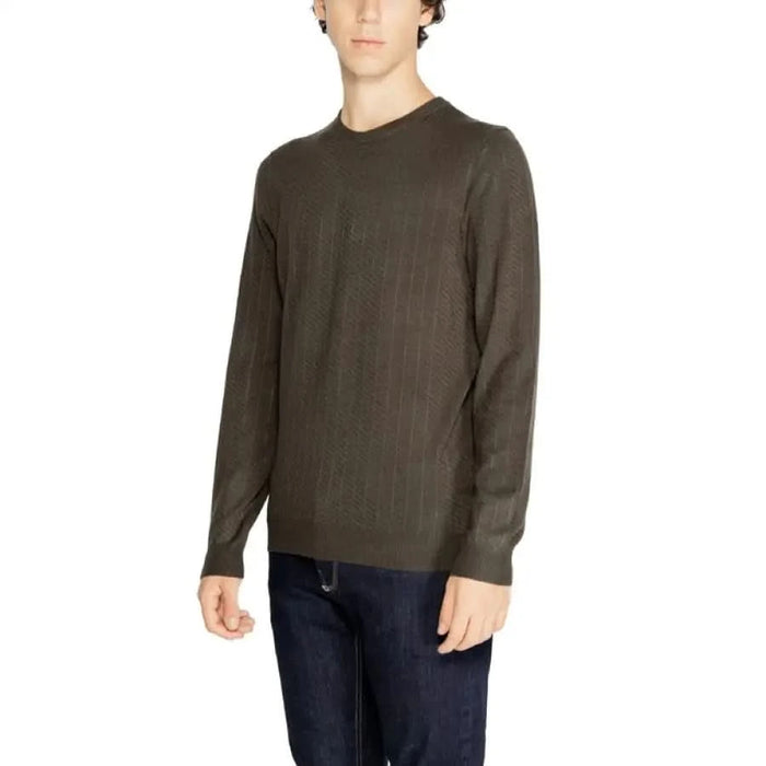 Dark olive green long-sleeved crew neck sweater by Antony Morato worn by a model