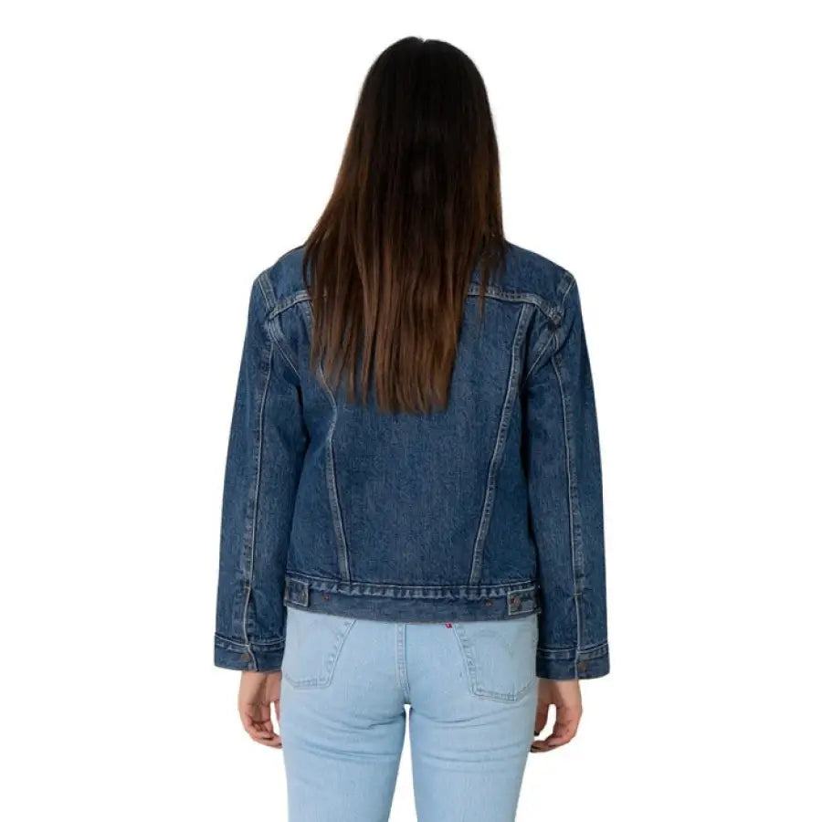 Levi’s women’s denim jacket worn by person with long brown hair, viewed from behind