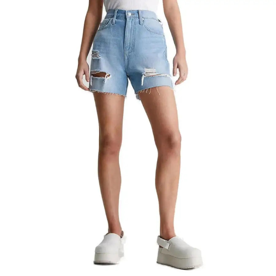 Calvin Klein distressed light blue denim shorts with ripped details for women
