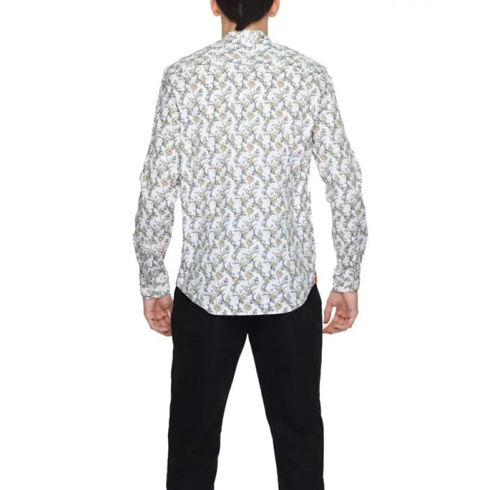 Gianni Lupo Men Shirt with floral patterns paired with black pants for a stylish look