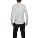 Gianni Lupo Men Shirt with floral patterns paired with black pants for a stylish look