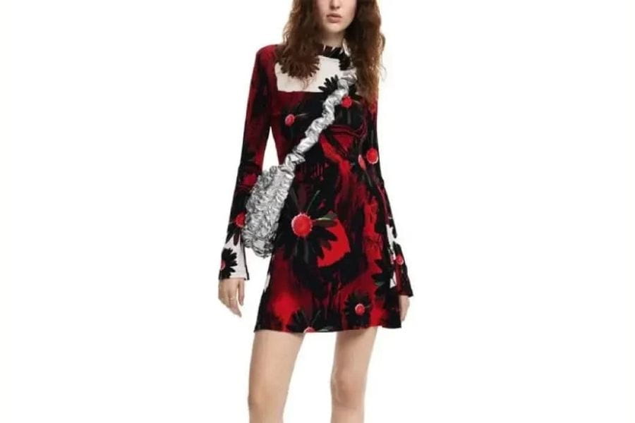 Floral-patterned mini dress with long sleeves in red, black, and white colors.