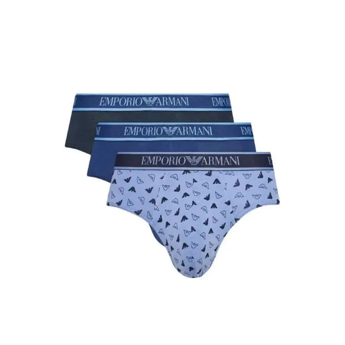 Four Emporio Armani men’s briefs in blue hues, featuring one geometric design