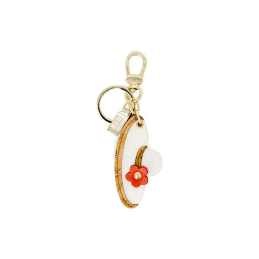 Gold-toned keychain with white crescent and red flower, enhancing Alviero Martini wallet