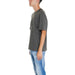 Gray oversized round neck t-shirt worn by a person in jeans from Armani Exchange Men