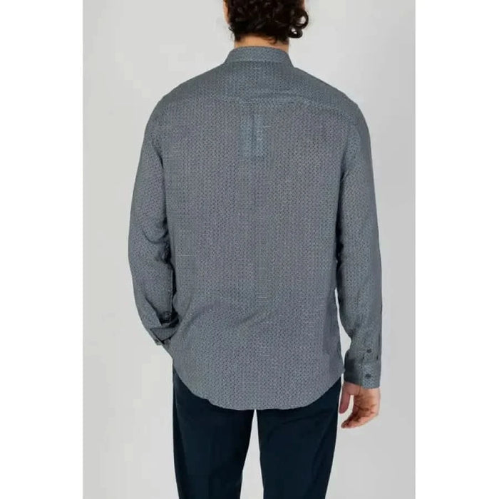 Gray patterned button-up shirt from Armani Exchange worn by a person seen from behind