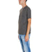 Gray short-sleeve t-shirt paired with light blue jeans from Armani Exchange