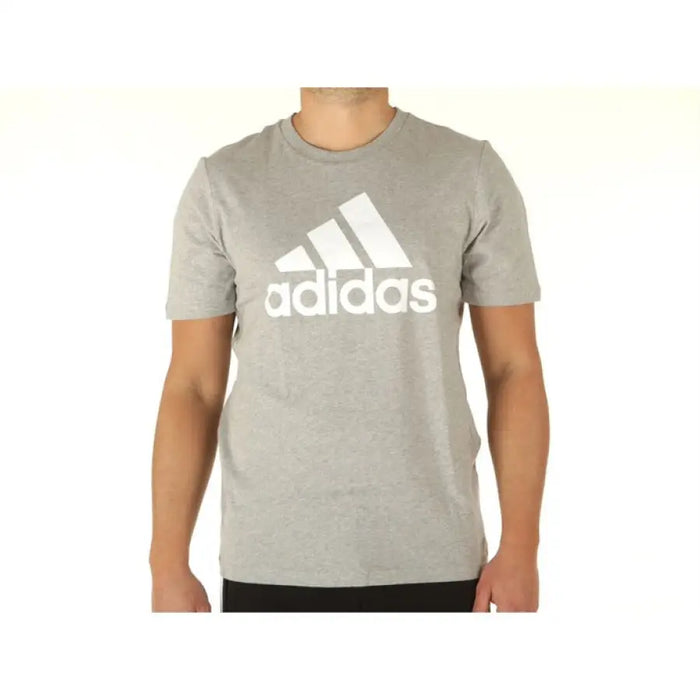 Grey Adidas Men T-Shirt featuring a prominent white logo for athletic wear