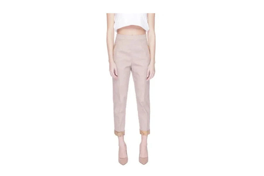 High-waisted beige trousers with tapered legs for minimalist apparel and accessories.