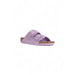 Lavender-colored Birkenstock sandal with adjustable straps and cork footbed for women