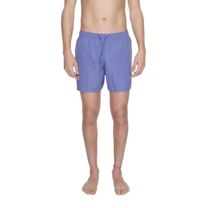 Lavender-colored swim shorts or board shorts from Ea7 Men Swimwear collection