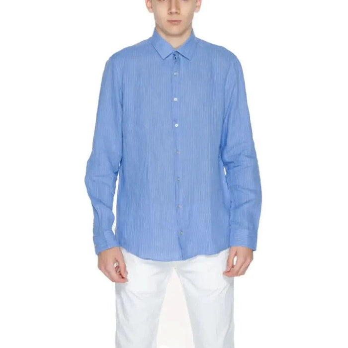 Light blue Calvin Klein men button-up dress shirt with collar and long sleeves