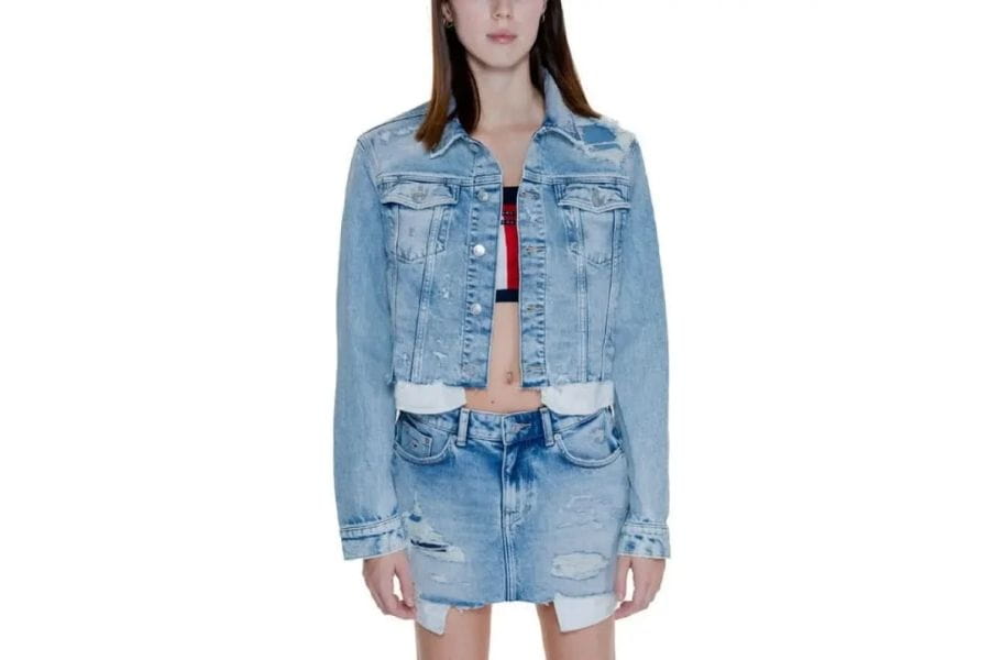 Light blue denim jacket with button-up front and chest pockets for retro fashion style.