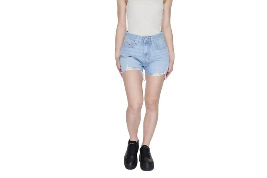 Light blue denim shorts with frayed hem for stylish holiday outfits.