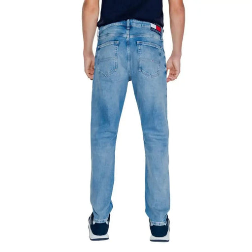 Light blue denim jeans on a person, featuring Tommy Hilfiger brand style