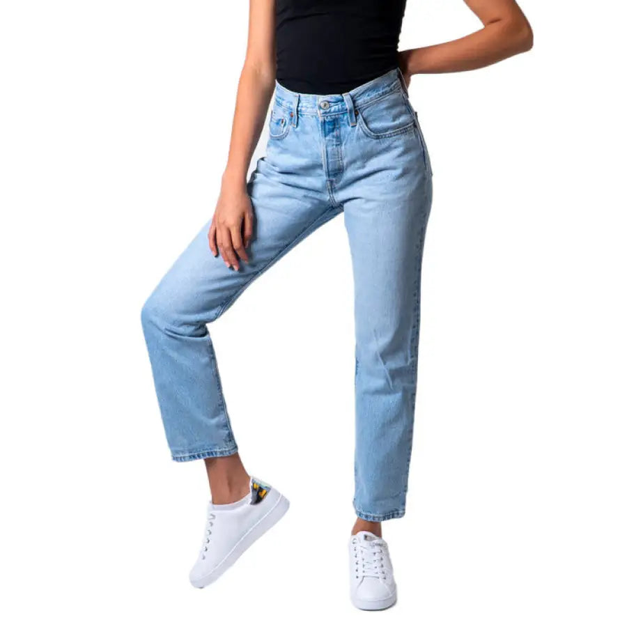 Levi’s Women’s Light Blue Straight-Leg Jeans with White Sneakers and Black Top