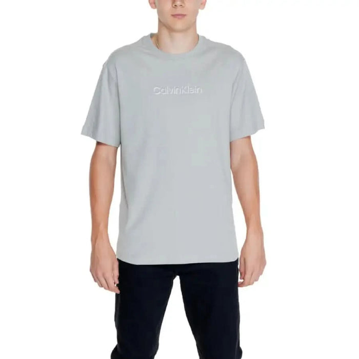 Person wearing light gray Calvin Klein t-shirt from Calvin Klein Men T-Shirt collection