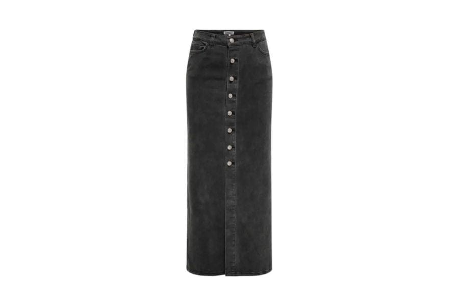 Long black denim skirt with button-front closure featured in retro style fashion article.