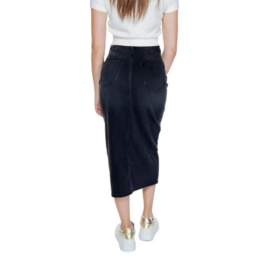 Long black denim skirt with back pockets worn with white sneakers - Vero Moda Women Skirt