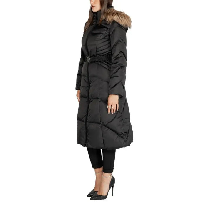 Long black puffer coat with fur-trimmed hood and belted waist by Guess Women Jacket