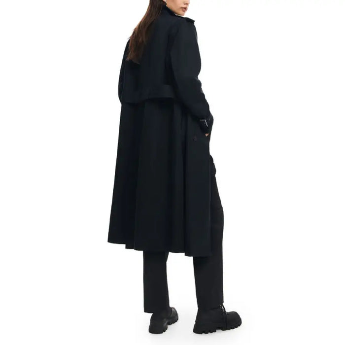 Long black wool coat worn by a person, showcasing Desigual Women Jacket from behind