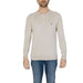 Man in beige sweater with blue horse from U.s. Polo Assn. Men Knitwear collection