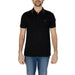 Man in Boss black polo shirt showcasing urban city style fashion