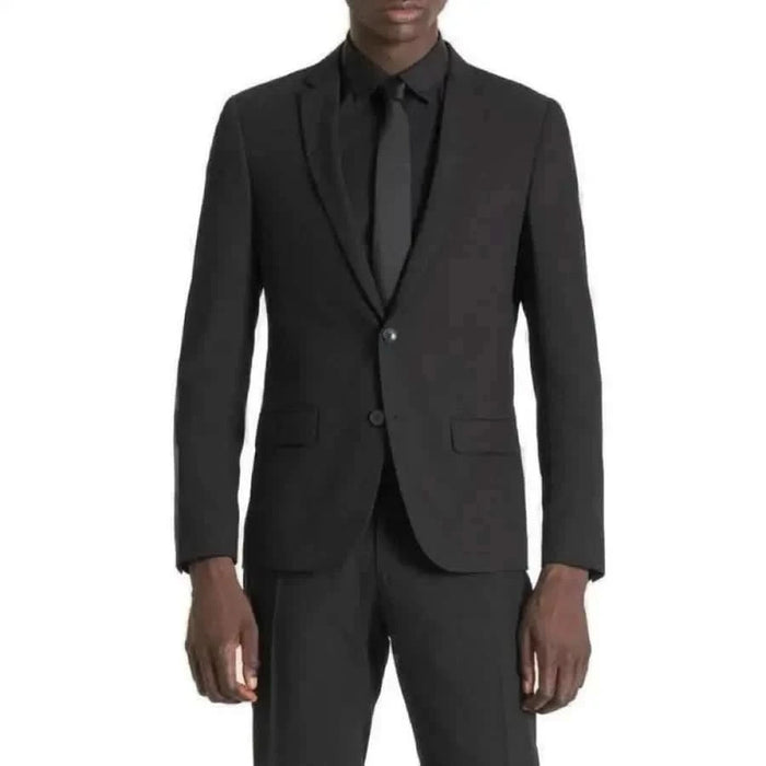 Antony Morato Men Blazer in urban city fashion - man in a black suit and tie