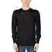 Man wearing a black sweater from Liu Jo Men Knitwear collection