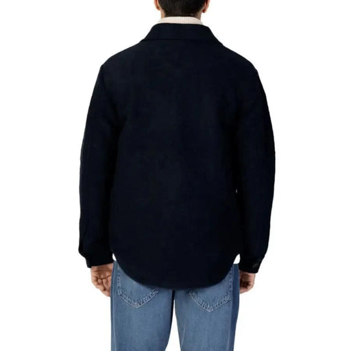 Man modeling Selected Selected Men Jacket in black sweater and jeans