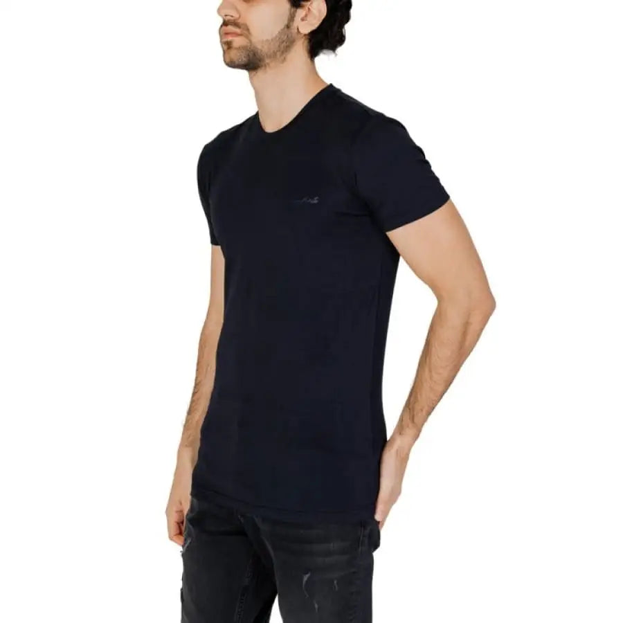 
                      
                        Man in Antony Morato black T-shirt and jeans from Antony Morato Men collection.
                      
                    