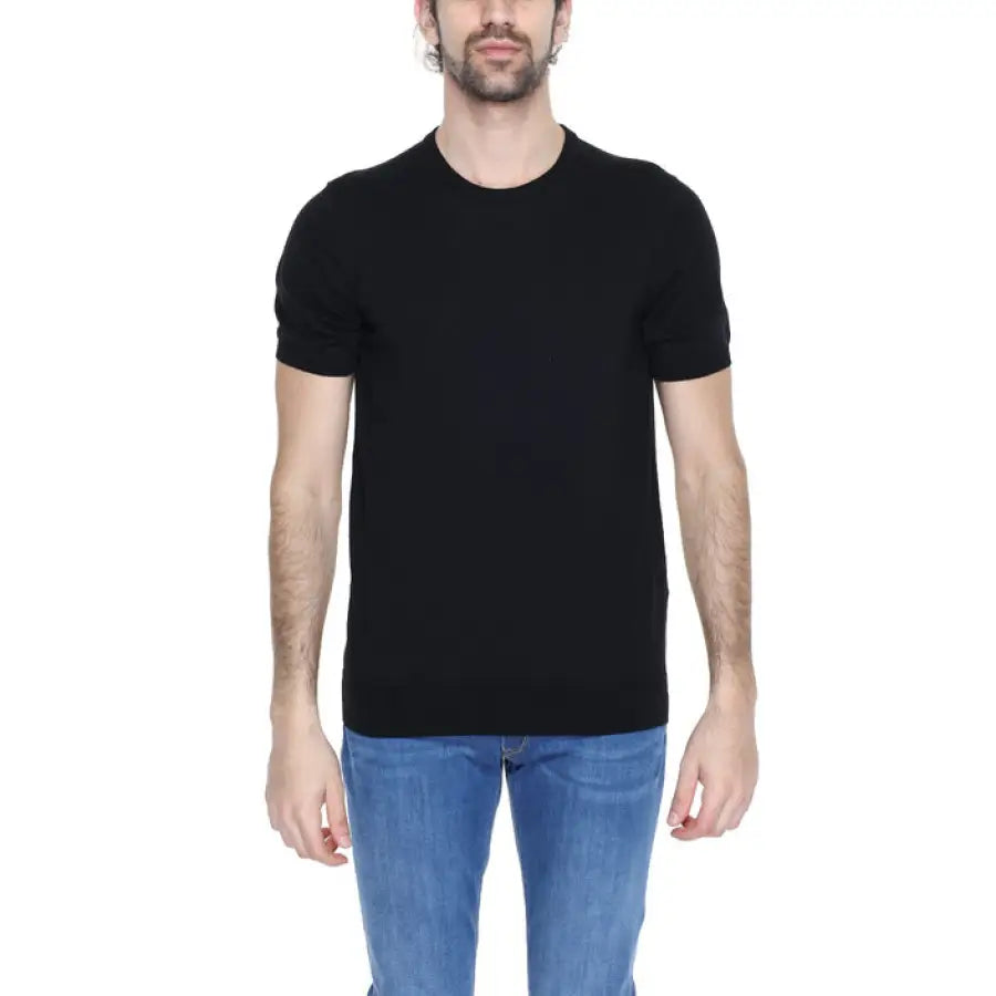 Man wearing black t-shirt from Diktat - Diktat Men Knitwear collection