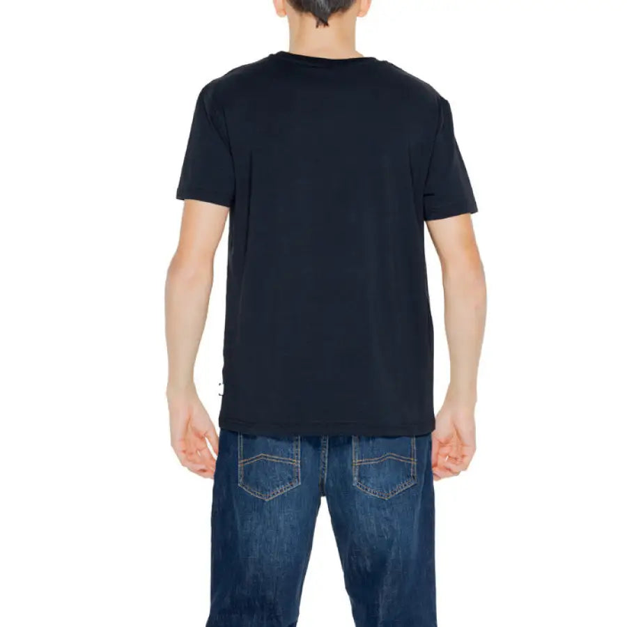 Man in black Moschino T-shirt and jeans - urban style, Moschino Underwear Men collection