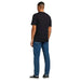 Man in Jack & Jones black t-shirt and blue jeans, viewed from behind