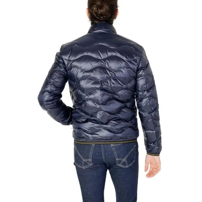 Man modeling a Blauer Blauer men jacket in blue, paired with jeans.