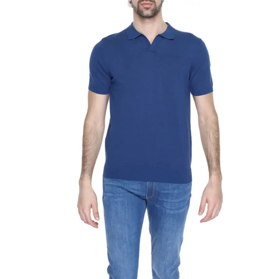 Man wearing a blue polo shirt from Diktat Men Knitwear collection