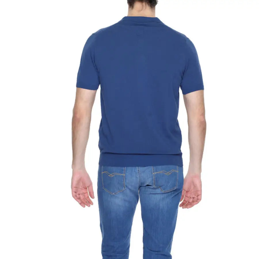 Man in blue shirt and jeans wearing Diktat - Diktat Men Knitwear