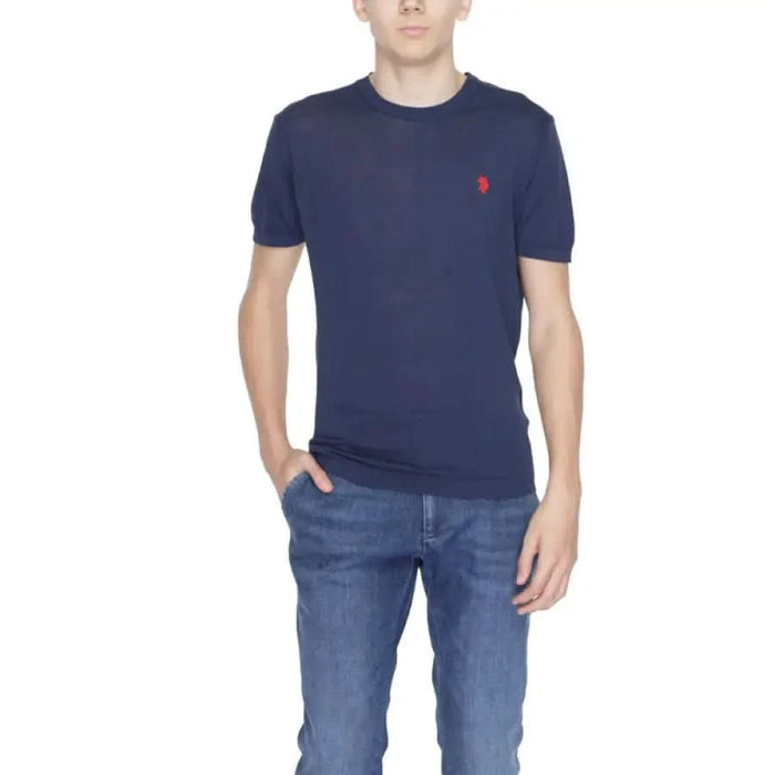 Man wearing a blue U.s. Polo Assn. T-shirt and jeans