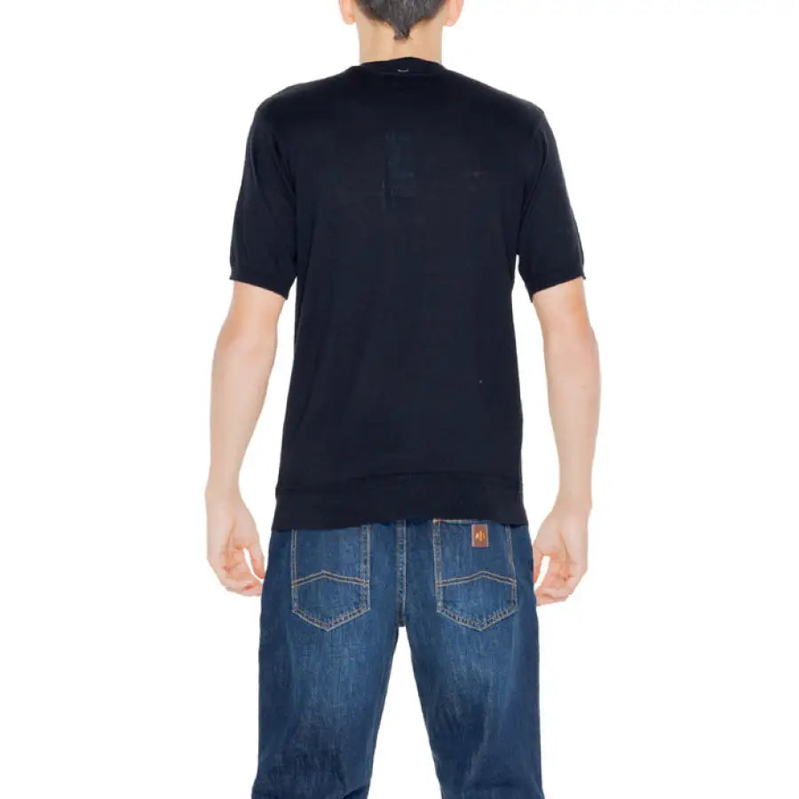 A man wearing jeans and a black shirt from Hamaki-ho Men Knitwear collection