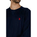 Man wearing navy sweater with red polo logo - U.S. Polo Assn. Men Knitwear